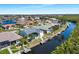 Aerial view of waterfront houses with docks and boat lifts along a scenic canal at 609 Macedonia Dr, Punta Gorda, FL 33950