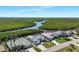 Gorgeous homes located along the water with mangroves on a sunny day at 609 Macedonia Dr, Punta Gorda, FL 33950