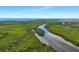 Expansive aerial view showcasing the lush green landscape and winding waterways at 609 Macedonia Dr, Punta Gorda, FL 33950