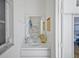 Cozy bathroom featuring white vanity, mirror, and nautical themed decor at 609 Macedonia Dr, Punta Gorda, FL 33950
