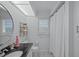 Bathroom featuring a vanity with dark countertop and a decorative light fixture at 609 Macedonia Dr, Punta Gorda, FL 33950