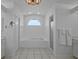 Bright bathroom featuring a soaking tub with tiled surround and walk-in shower at 609 Macedonia Dr, Punta Gorda, FL 33950