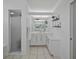 Bathroom featuring walk-in shower, vanity with counter space, and modern shelving at 609 Macedonia Dr, Punta Gorda, FL 33950