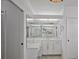 Bathroom featuring a large mirror, vanity with counter space and lots of storage at 609 Macedonia Dr, Punta Gorda, FL 33950