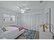Bright bedroom featuring white furnishings, ceiling fan and lots of natural light at 609 Macedonia Dr, Punta Gorda, FL 33950