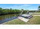 Waterfront property featuring a private boat lift for easy access to the waterways at 609 Macedonia Dr, Punta Gorda, FL 33950