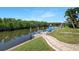 Scenic waterfront property featuring a private dock with boat lift and dock with a lovely view of the canal at 609 Macedonia Dr, Punta Gorda, FL 33950