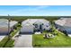 Charming home with well-manicured lawn, lush landscaping, and a three-car garage at 609 Macedonia Dr, Punta Gorda, FL 33950