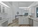 Well-lit kitchen featuring stainless appliances, light countertops, ample cabinetry, and an open design at 609 Macedonia Dr, Punta Gorda, FL 33950