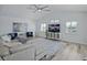 Inviting living room with a neutral color palette, wood floors, and vaulted ceilings at 609 Macedonia Dr, Punta Gorda, FL 33950