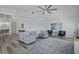 Spacious living room with modern furnishings, light wood floors, and an open layout at 609 Macedonia Dr, Punta Gorda, FL 33950