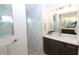 Contemporary bathroom showcasing marble-look tile in the shower, modern fixtures, and a sleek vanity at 9529 Calumet Blvd, Port Charlotte, FL 33981