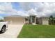 Beautiful single-story home with a three-car garage and well-manicured lawn, perfect for families or retirees at 9529 Calumet Blvd, Port Charlotte, FL 33981