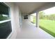 Spacious covered lanai overlooking the lush lawn, ideal for enjoying the outdoors at 9529 Calumet Blvd, Port Charlotte, FL 33981