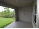 Covered lanai overlooking the lawn, perfect for outdoor entertaining with a view of nature at 9529 Calumet Blvd, Port Charlotte, FL 33981