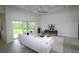 Bright living room featuring a cozy seating area, stylish decor, and sliding glass doors with backyard views at 9529 Calumet Blvd, Port Charlotte, FL 33981