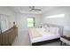 Serene primary bedroom featuring a tray ceiling, plush carpeting, a comfy bed and plenty of natural light at 9529 Calumet Blvd, Port Charlotte, FL 33981
