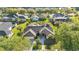 Overhead shot of a home with a well-maintained lawn, a screened pool, and mature landscaping at 1068 Harbour Cape Pl, Punta Gorda, FL 33983