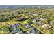 A sprawling aerial view showing houses backing to wooded nature area offering serene privacy and a beautiful neighborhood setting at 1068 Harbour Cape Pl, Punta Gorda, FL 33983