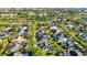 This aerial view shows homes interspersed with lush greenery, creating a serene and picturesque setting at 1068 Harbour Cape Pl, Punta Gorda, FL 33983