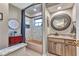 Stylish bathroom with tub-shower combo, vanity with granite countertop, and decorative mirror at 1068 Harbour Cape Pl, Punta Gorda, FL 33983