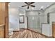 Beautiful bathroom featuring wood-like flooring and a luxurious glass shower with decorative tile at 1068 Harbour Cape Pl, Punta Gorda, FL 33983