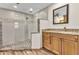 Elegant bathroom showcases a glass shower, stylish vanity with granite countertops, and modern fixtures at 1068 Harbour Cape Pl, Punta Gorda, FL 33983