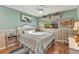Inviting bedroom featuring a comfortable bed, wood floors, and soft, relaxing color scheme, enhancing comfort at 1068 Harbour Cape Pl, Punta Gorda, FL 33983