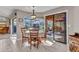 Bright breakfast nook with a round table and a sliding door to the pool at 1068 Harbour Cape Pl, Punta Gorda, FL 33983
