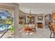 Bright dining area adjacent to the pool, offering serene views and natural light at 1068 Harbour Cape Pl, Punta Gorda, FL 33983