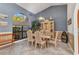 Open dining room with vaulted ceilings, natural light, and dining table with seating for six at 1068 Harbour Cape Pl, Punta Gorda, FL 33983