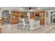 Spacious kitchen with a central island, bar seating, and modern stainless steel appliances at 1068 Harbour Cape Pl, Punta Gorda, FL 33983