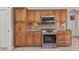 Updated kitchen features wood cabinets, granite countertops, stainless appliances and tile floors at 1068 Harbour Cape Pl, Punta Gorda, FL 33983