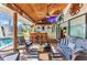 Well-appointed lanai with a custom tiki bar, comfortable seating, and tropical accents, great for entertaining at 1068 Harbour Cape Pl, Punta Gorda, FL 33983