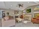 Inviting living room with neutral tones, a white piano, and ample natural light at 1068 Harbour Cape Pl, Punta Gorda, FL 33983