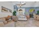 Cozy living room with tile floors, neutral furniture, and unique architectural details at 1068 Harbour Cape Pl, Punta Gorda, FL 33983