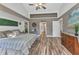 Well-lit main bedroom with decorative wall accents and access to en suite bathroom at 1068 Harbour Cape Pl, Punta Gorda, FL 33983