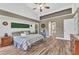Bright main bedroom with neutral decor, wood flooring, and a comfortable layout at 1068 Harbour Cape Pl, Punta Gorda, FL 33983