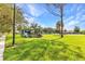 Community playground featuring play equipment and open green space for recreation at 1068 Harbour Cape Pl, Punta Gorda, FL 33983