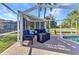 Outdoor seating area on brick patio with lounge furniture, perfect for relaxing and enjoying the outdoors at 1068 Harbour Cape Pl, Punta Gorda, FL 33983