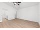 Bedroom with wood-look floors, a ceiling fan, and an en suite bathroom at 111 Swan Dr, Rotonda West, FL 33947