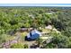 Aerial view of the home that is surrounded by mature trees and close proximity to neighbors at 14289 Manatee Rd, Parrish, FL 34219
