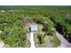 An aerial view of home surrounded by mature trees at 14289 Manatee Rd, Parrish, FL 34219