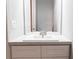 Bright bathroom showcasing a vanity with ample counter space and a large mirror at 14289 Manatee Rd, Parrish, FL 34219