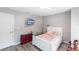 Bedroom features wood-look floors, a television, and a white bedframe at 14289 Manatee Rd, Parrish, FL 34219