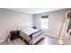 Bedroom features wood-look floors, gray walls, and a white bedframe at 14289 Manatee Rd, Parrish, FL 34219