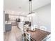 Open concept dining area showcasing seamless flow to the modern kitchen and a comfortable living space at 14289 Manatee Rd, Parrish, FL 34219