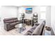 Comfortable living room with modern decor, featuring a sofa, loveseat, and media center at 14289 Manatee Rd, Parrish, FL 34219