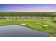 Beautiful community with a golf course surrounded by lush green trees and serene lake views at 14381 Heritage Landing Blvd, Punta Gorda, FL 33955