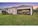 Lovely backyard with a screened lanai and meticulously maintained lawn at 14381 Heritage Landing Blvd, Punta Gorda, FL 33955
